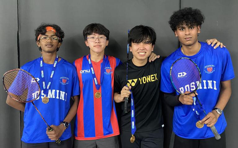 Rosmini claims badminton title